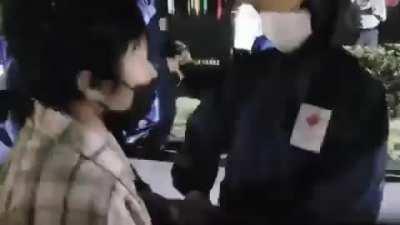 …trying to extinguish the Olympic torch