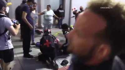 BLMers/anti-police protesters sucker punch man holding a dog multiple times, street 