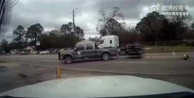 Truck pulling a trailer turns in front of motorcycle