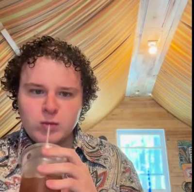 Me eating bacon and cheese burger sliders, fries, and drinking a sweet tea while “Ding Dang” plays.