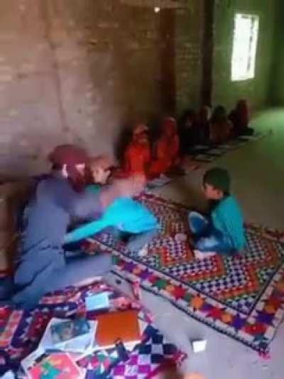 Madarsa teacher brutally beats kids while peeping at the camera