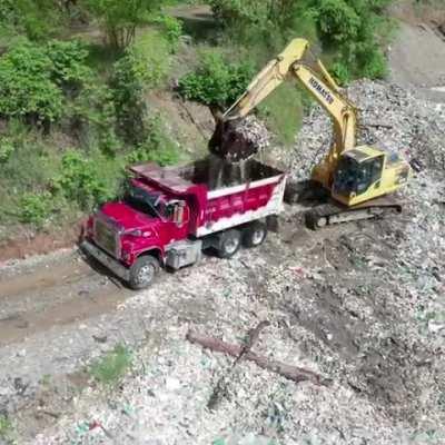 The Ocean Cleanup scooping literal truckloads of plastic out of the Rio Las Vacas river