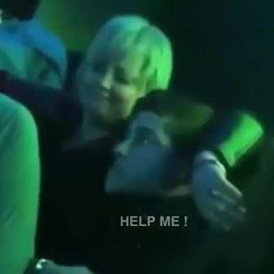 Older woman aggressively hits on a young guy.