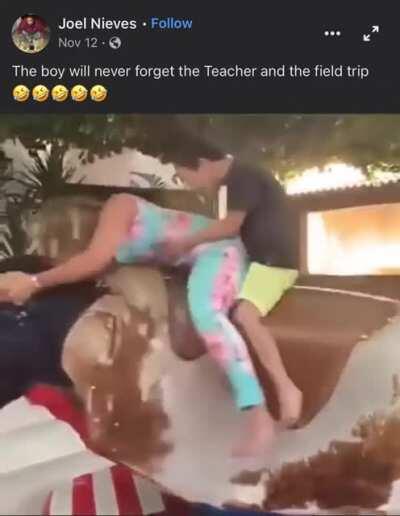 doing a carnival bull ride with a student behind