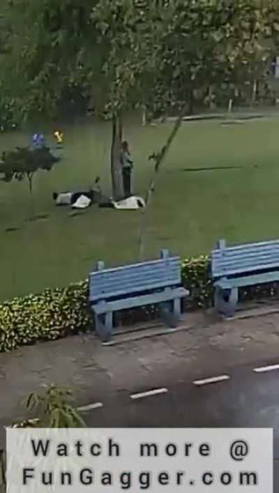 Standing under a tree in the rain