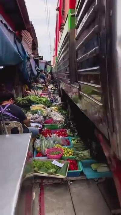 Thai railway market buzzing with life