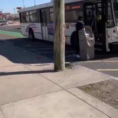 Rioter trying to steal an ATM