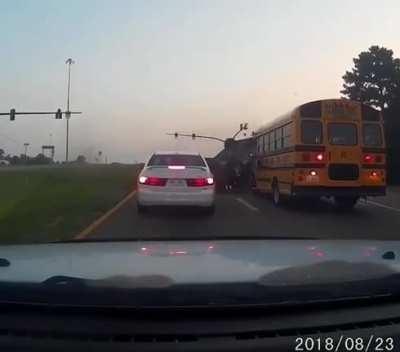 Car speeds across the median, then flips into a school bus after hitting another vehicle.