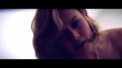 Brie Larson riding with a big smile (brighten up)