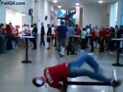 Man tries to do a trick on a table