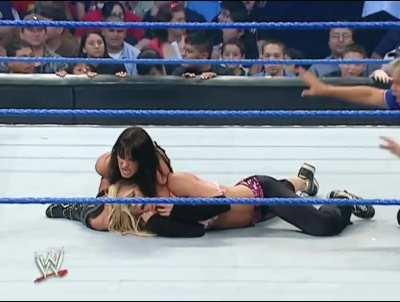 Victoria applies a long sleeperhold on Torrie Wilson as she talks shit to her. “Come on Princess!”