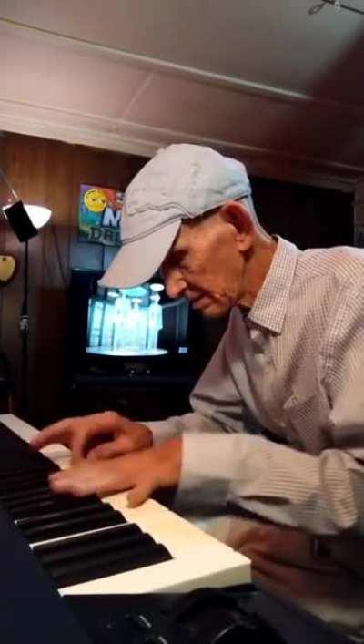 Grandpa 'Funky Geezer' casually warms up his fingers between naps.