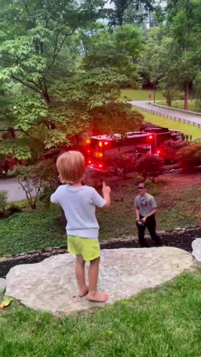 firefighter spotted a little boy waving as his truck passed by.. and decided to turn it into a moment he'd never forget