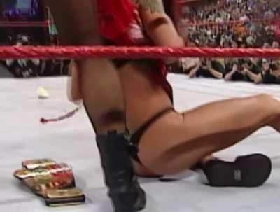 Lita gets ragdolled and stripped of her clothes