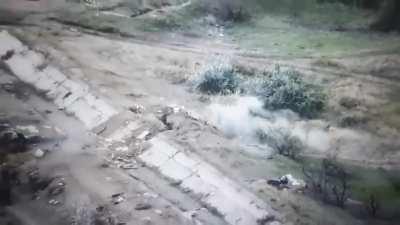 Ukrainian soldiers assault a Russian position