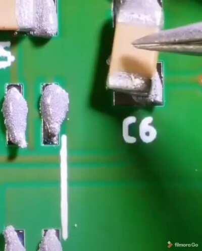 Micro view of soldering a circuit board with paste and an iron