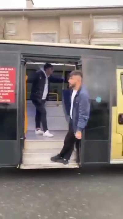 hanging outside a bus