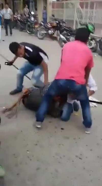 Man performs a double leg takedown on a Machete wielding attacker