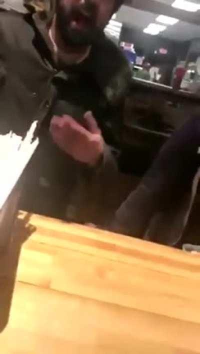 Cashier pops her tit out as a power move while berating a customer