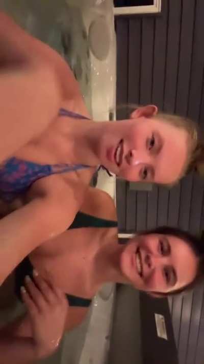 2 bops chilling in a hot tub.