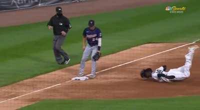 Luis Robert, the ultimate human specimen, demonstrates a graceful slide to steal third base