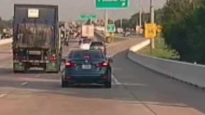 [OC] Here's a dump truck that can't miss their exit. Caught on my way to college