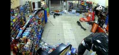 Car crashes into gas station 