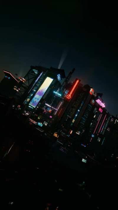 I took 24 pictures of Night City at the exact same location but at each hour and turned it into my new phone wallpaper!