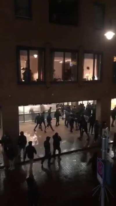 Anti-curfew rioters looting a grocery store and a post office in Den Bosch, the Netherlands tonight
