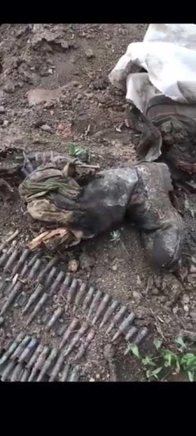 Two Russian soldiers fall into a deadly Ukrainian trap hidden in the trench.
