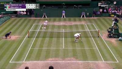 Djokovic rushing in for an athletic point during his run at his 20th major title