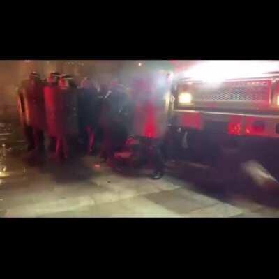 Protestors and riot police clash in Paris, France last night in response to French Government passing new police laws.