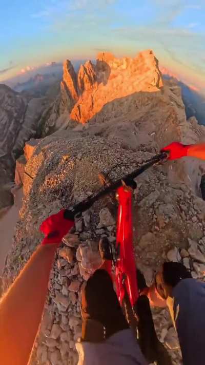 Insane cycling along razor edge in dolomites Italy