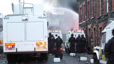 Anti migrant rioters throw bricks, bottles, fireworks and petrol bombs at police in Ballymena, Northern Ireland