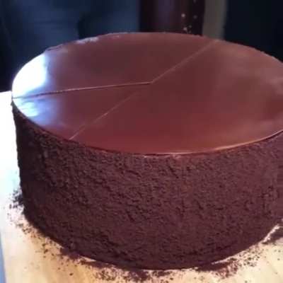 Cutting this chocolate cake 