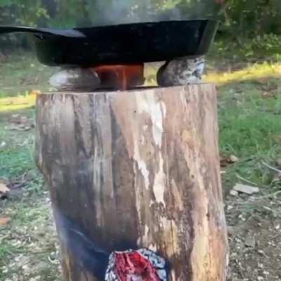 DIY rocket stove from a tree stump.
