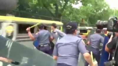 Police runs over protesters.