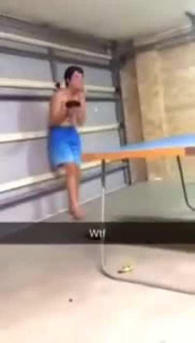 Kid throws ping pong paddle at his brother