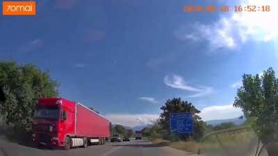 BMW driver crosses a double white line and barely escapes a collision