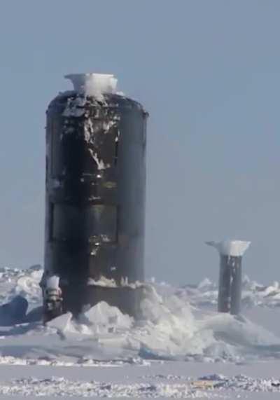 A Submarine emerging from ice.