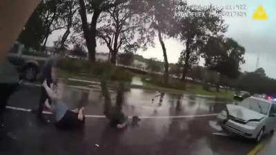 Cops were at the scene of a car accident when another car hits