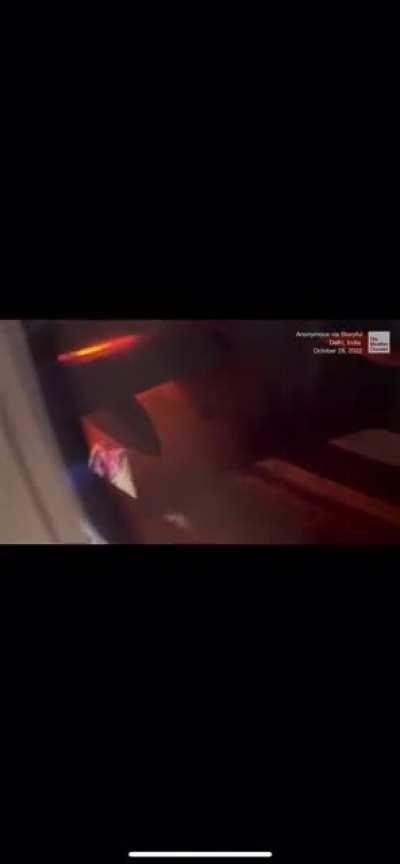 Plane leaving Delhi, India is forced to return to runway after sparks from engine were seen.