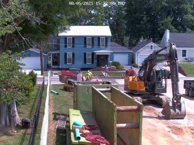 She literally drove around the road closed sign and crossed the wet cement in the wrong lane.