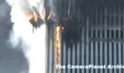 Molten metal gushing out of WTC 2 moments before collapse