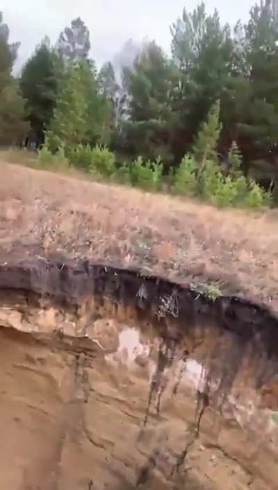 Deep sinkhole in a Russian field