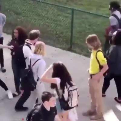 Guy defends himself from a girl and then procceeds to get punched by a whole gang