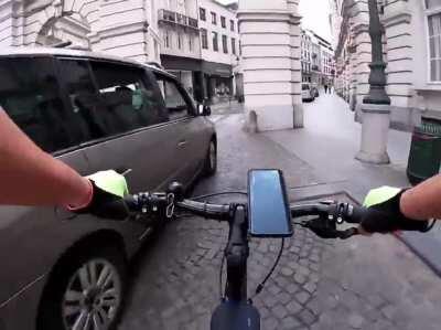 idiot cuts off cyclist