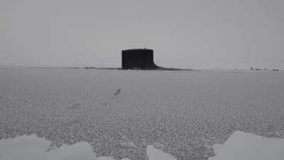 Virginia Block II class USS New Mexico (SSN-779) surfacing through the Arctic ice during Ice Exercise (ICEX) 2014 on 22/03/2014. USN video by MCS 2nd class Joshua Davies.