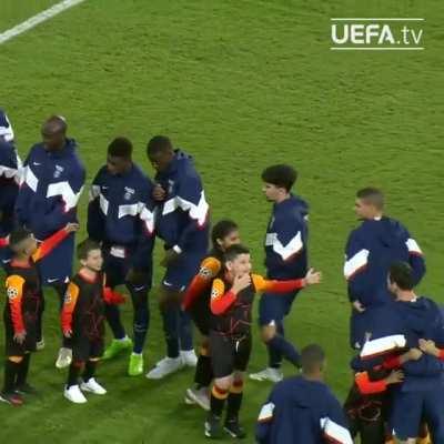 Child mascorts seeing Lionel Messi