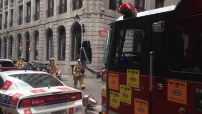 WCGW parking in front of a burning building